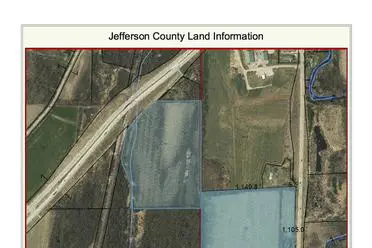 Aerial map of jefferson county showing roads, water bodies, and plots of land with labels and boundaries.