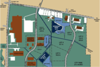 Blurry map of a facility featuring labeled buildings including administrative offices and storage areas, set against green and beige background.